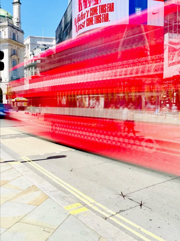 Red London Bus In Motion Photo