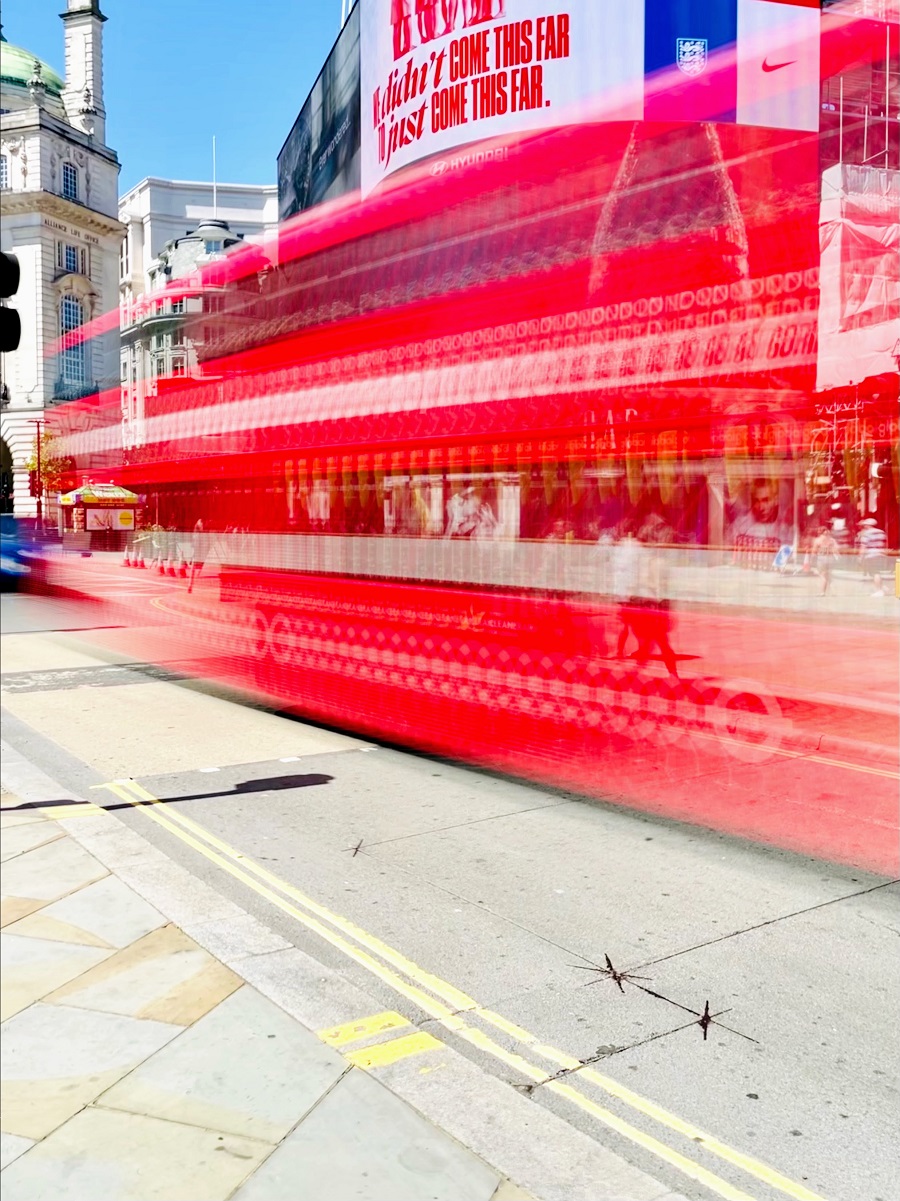 Red London Bus In Motion Photo
