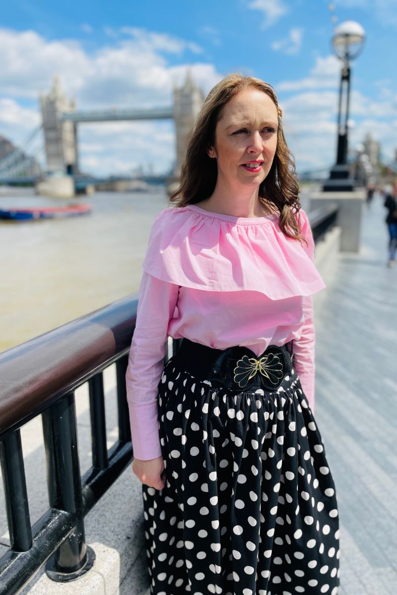 How To Style A Pink Shirt With A Black Polka Dot Skirt